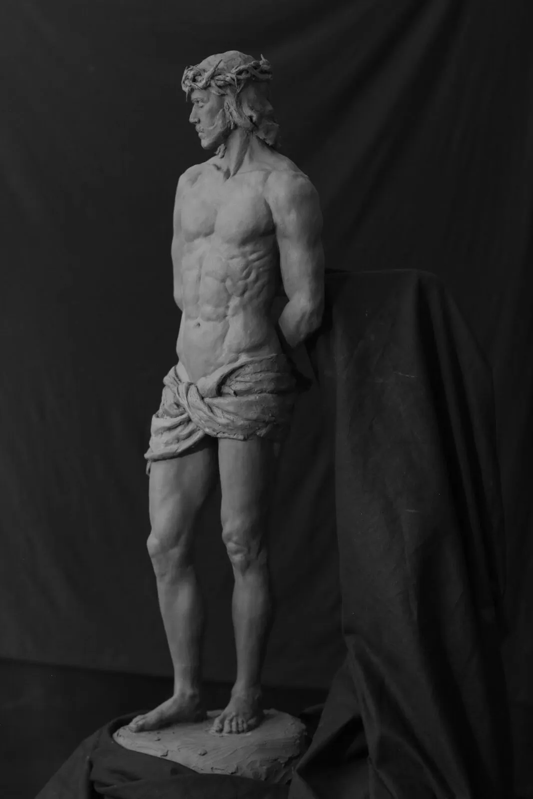 Full figure of Christ crowned with thorns, in clay