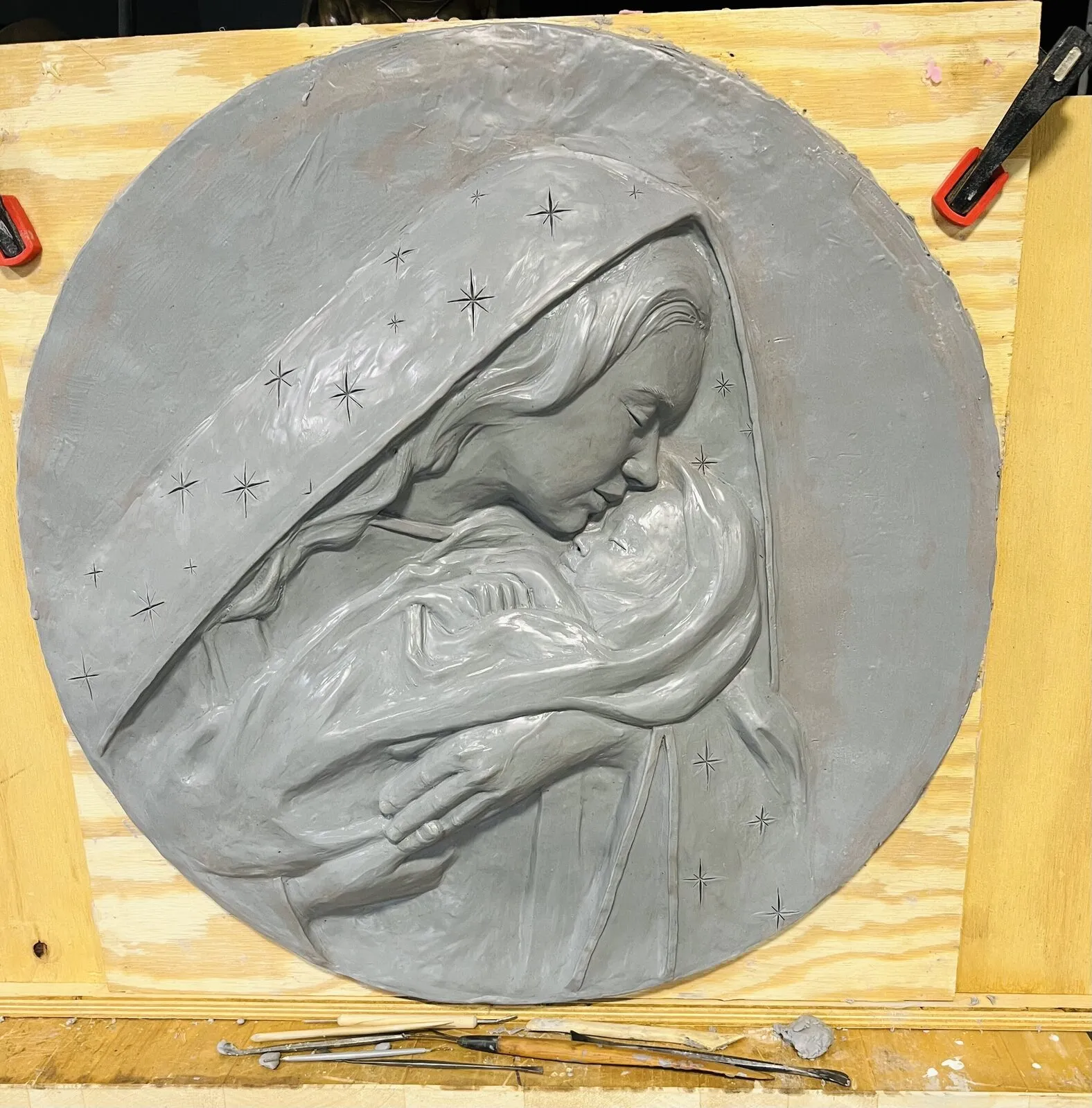 Relief of the Madonna and Child in clay