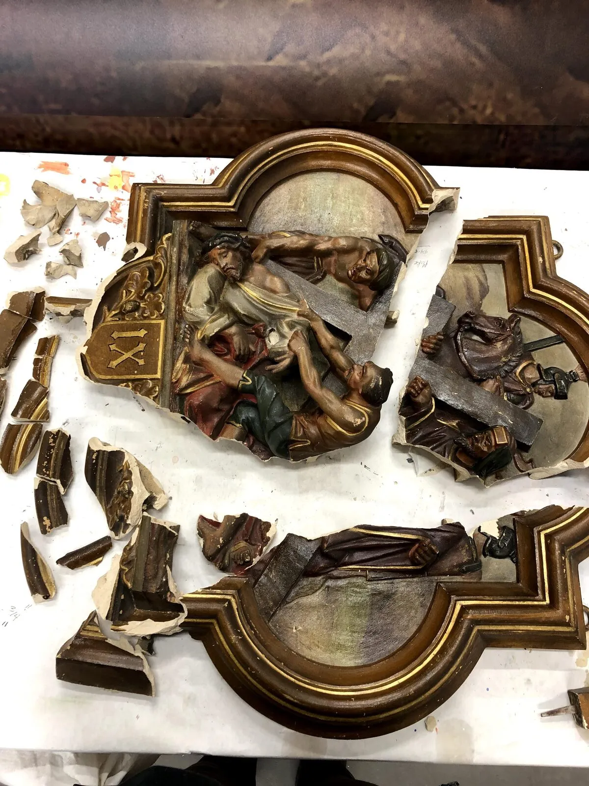 Station of the Cross broken into fragments, before restoration